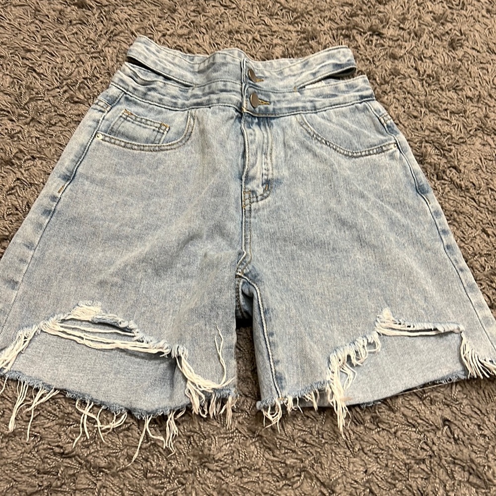 High rise short. The short has been worn. item in excellent condition